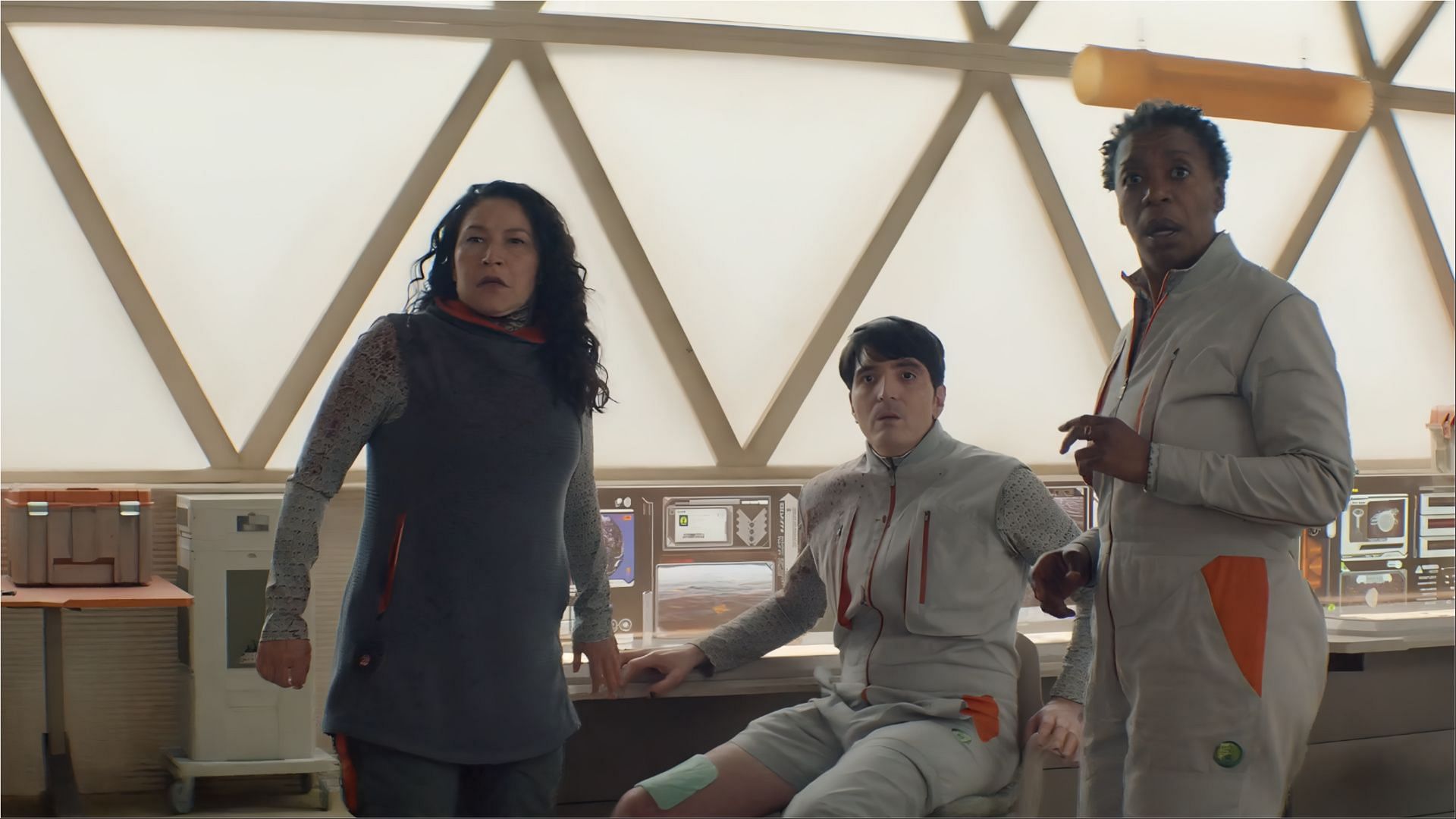 The PreservationAux team reacts to a critical situation during their mission in episode 8. (Image via AppleTv)